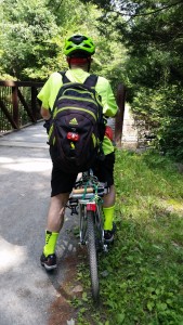 On bike with backpack